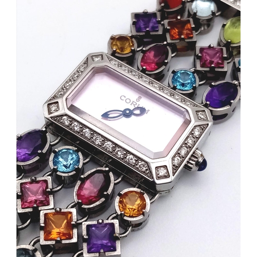 591 - A Corum Gemstone and Diamond Ladies Watch. Multi-gemstone bracelet with diamond bar separators. Case... 