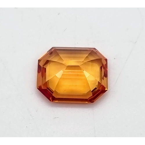 133 - A high Quality, Large 16.41ct Orange Sapphire. Rectangular step cut, excellent, vivid and uniform co... 