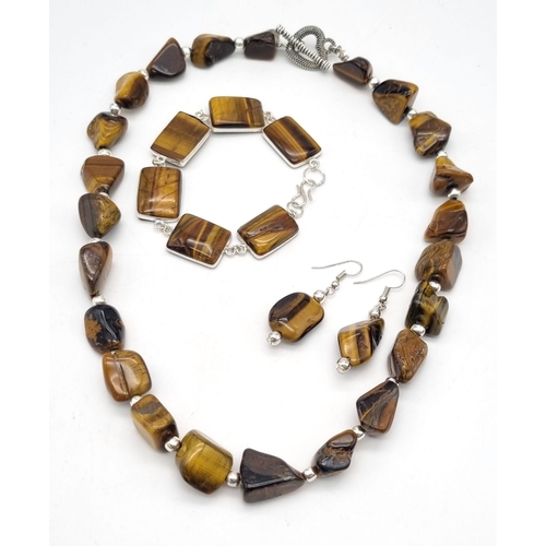 140 - A fashionable, vintage, TIGER’S EYE necklace, earrings and bracelet. Totally natural, large cabochon... 