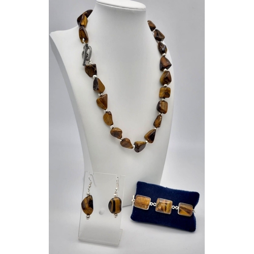 140 - A fashionable, vintage, TIGER’S EYE necklace, earrings and bracelet. Totally natural, large cabochon... 