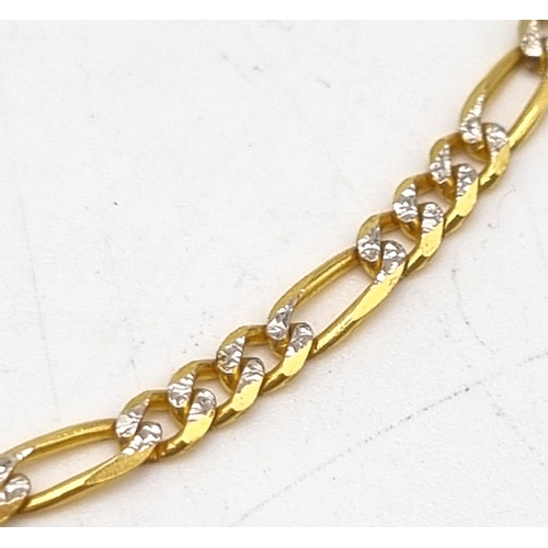 32 - A 9K Yellow and White Gold Figaro Link Bracelet. 24cm. 3.33g total weight.
