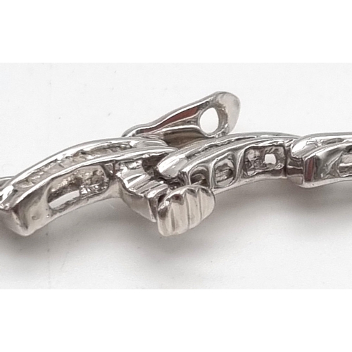 354 - A 14K White Gold Baguette Diamond bracelet, 2ct approx. Weighs 10.72g total weight. 18cm length.