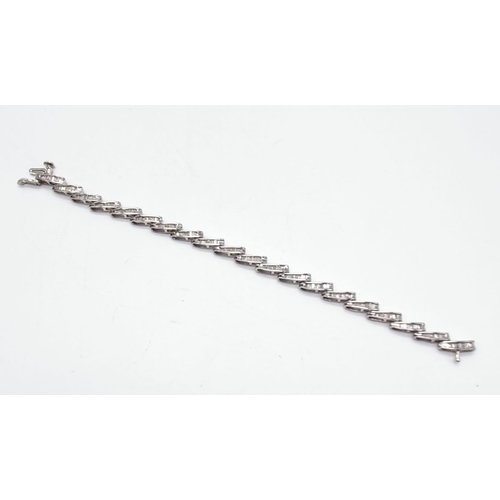 354 - A 14K White Gold Baguette Diamond bracelet, 2ct approx. Weighs 10.72g total weight. 18cm length.