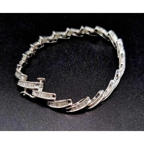 354 - A 14K White Gold Baguette Diamond bracelet, 2ct approx. Weighs 10.72g total weight. 18cm length.