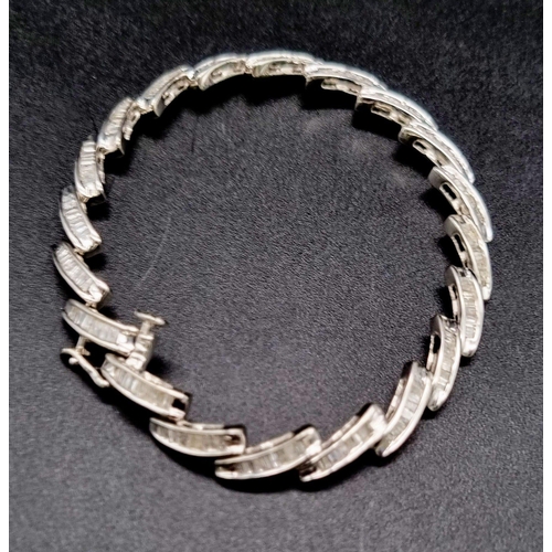 354 - A 14K White Gold Baguette Diamond bracelet, 2ct approx. Weighs 10.72g total weight. 18cm length.