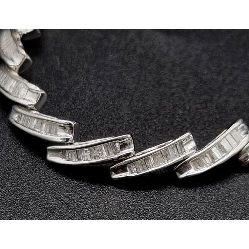 354 - A 14K White Gold Baguette Diamond bracelet, 2ct approx. Weighs 10.72g total weight. 18cm length.