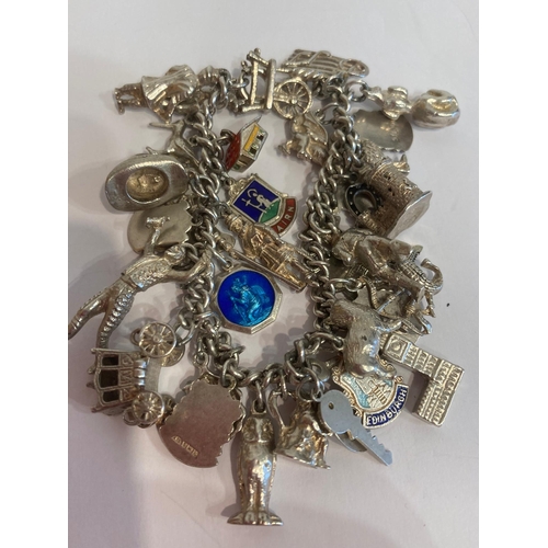 537 - Vintage SILVER CHARM BRACELET , absolutely full of SILVER CHARMS to include Spinning wheel, Castle,I... 