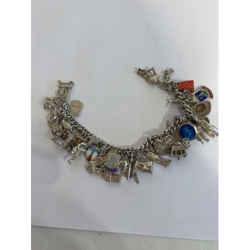 537 - Vintage SILVER CHARM BRACELET , absolutely full of SILVER CHARMS to include Spinning wheel, Castle,I... 