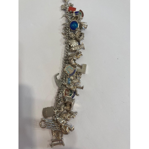 537 - Vintage SILVER CHARM BRACELET , absolutely full of SILVER CHARMS to include Spinning wheel, Castle,I... 