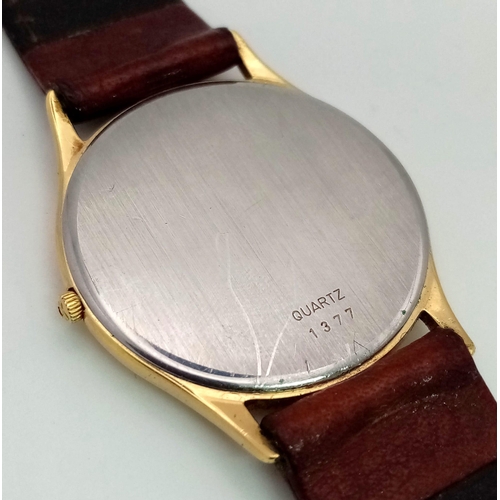 74 - An Omega Deville Quartz Gents Mid-Size watch. Brown leather strap. Two tone case - 30mm. White dial.... 