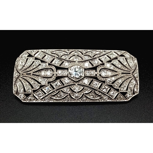 181 - An Art Deco Style Platinum and Diamond Brooch Pin. Geometric pierced decoration. 3ct approx. 5cm wid... 