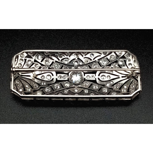 181 - An Art Deco Style Platinum and Diamond Brooch Pin. Geometric pierced decoration. 3ct approx. 5cm wid... 