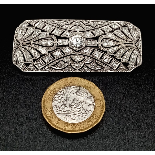 181 - An Art Deco Style Platinum and Diamond Brooch Pin. Geometric pierced decoration. 3ct approx. 5cm wid... 