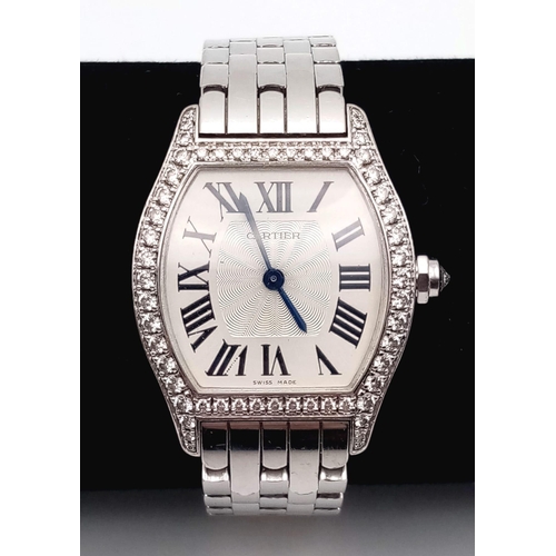 213 - A Cartier 18K Gold and Diamond Tortue Ladies Watch. 18K gold bracelet and case - 25mm. White dial. M... 