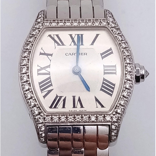 213 - A Cartier 18K Gold and Diamond Tortue Ladies Watch. 18K gold bracelet and case - 25mm. White dial. M... 