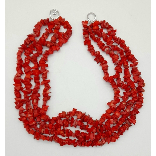 245 - An exotic, four strand, natural red coral, necklace. Length: 48 cm, weight: 234 g.