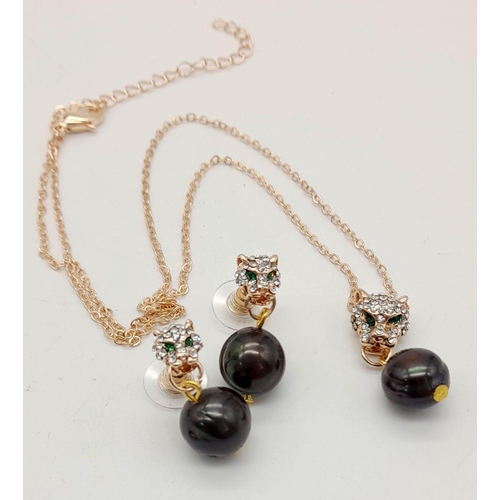 301 - A very elegant panther necklace and matching earrings set with natural, black, Tahitian pearls. Pres... 