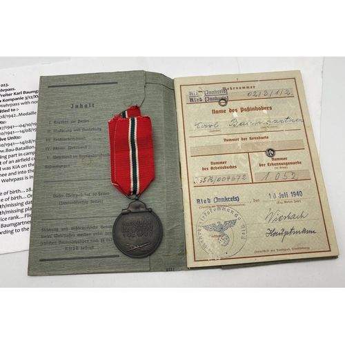 306 - WW2 German Luftwaffe Wehrpass/Service Book and Eastern Front Medal. The service book named to one Pr... 