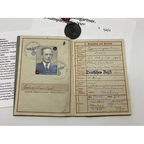 306 - WW2 German Luftwaffe Wehrpass/Service Book and Eastern Front Medal. The service book named to one Pr... 