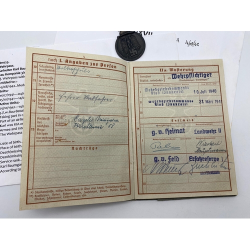 306 - WW2 German Luftwaffe Wehrpass/Service Book and Eastern Front Medal. The service book named to one Pr... 