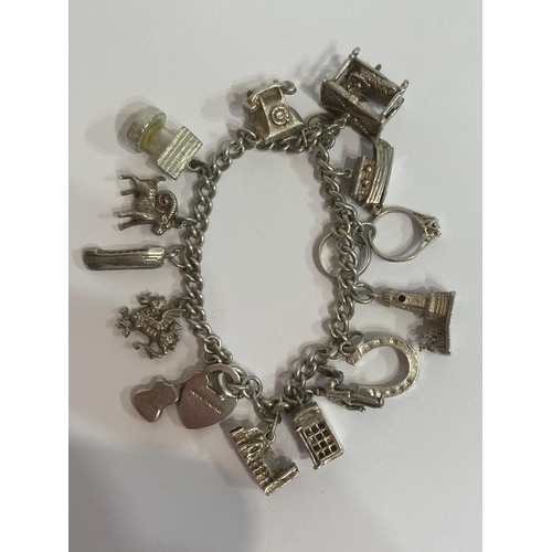 167 - Vintage SILVER CHARM BRACELET complete with 15 SILVER CHARMS to include Wishing well,houseboat, tele... 