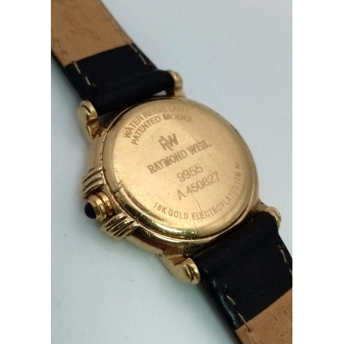 447 - A Raymond Weil Gold Plated Ladies Watch. Black leather strap. Case - 26mm. Black dial with date wind... 