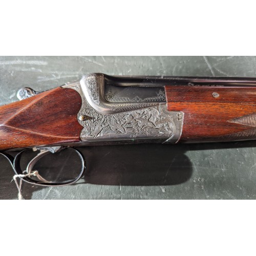 294 - A 12 Gauge Merkel Over/Under Shotgun. Serial number - 59499. 28 inch barrels. 2.75 inch chambers. 14... 