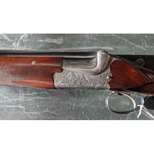 294 - A 12 Gauge Merkel Over/Under Shotgun. Serial number - 59499. 28 inch barrels. 2.75 inch chambers. 14... 