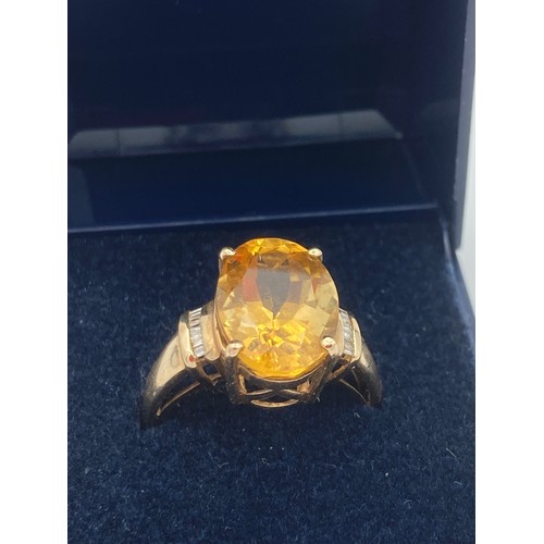 602 - 9 carat GOLD CITRINE AND DIAMOND RING, having large 3 carat cushion cut CITRINE SOLITAIRE set to top... 