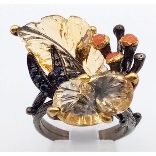 227 - A late Victorian or Edwardian, unique, sterling silver ring with large carved gemstones creating a n... 