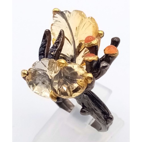 227 - A late Victorian or Edwardian, unique, sterling silver ring with large carved gemstones creating a n... 