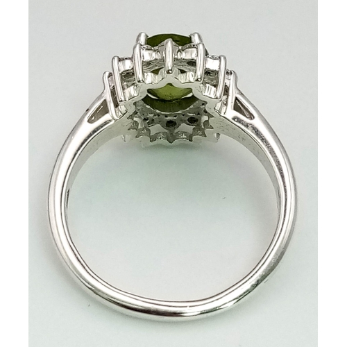 464 - 1.97 Ct Peridot 925 Silver Ring With White Topaz Stone surround. Size O.