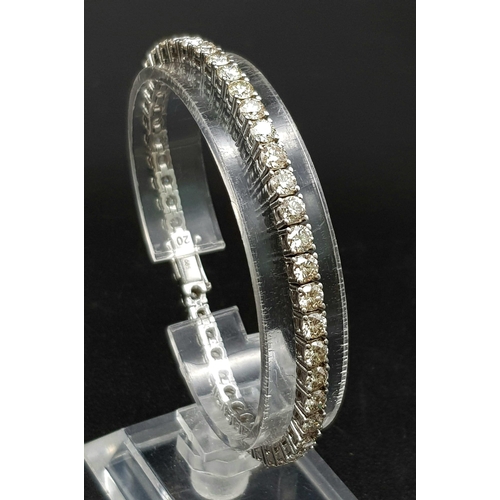 1203 - A 14K White Gold Diamond Tennis Bracelet. 46 brilliant round cut diamonds. 10ct approx. 19cm. 15.8g ... 