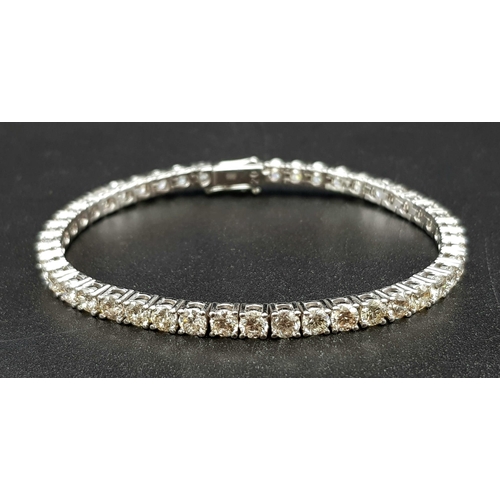 1203 - A 14K White Gold Diamond Tennis Bracelet. 46 brilliant round cut diamonds. 10ct approx. 19cm. 15.8g ... 