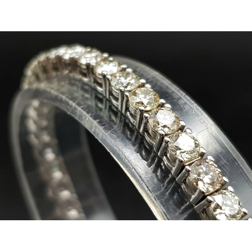 1203 - A 14K White Gold Diamond Tennis Bracelet. 46 brilliant round cut diamonds. 10ct approx. 19cm. 15.8g ... 