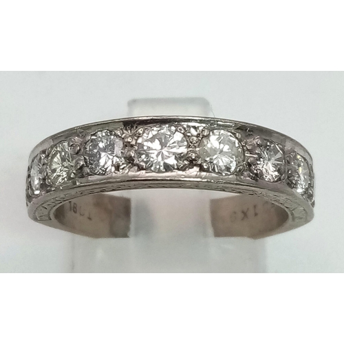 111 - An 18K White Gold Diamond Eternity Ring. Nine round cut diamonds - 0.90ct. Size O. 5.06g total weigh... 