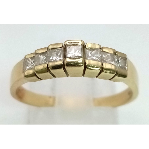 335 - A 14K Yellow Gold and Diamond Half-Eternity Ring. Seven square-cut diamonds. Size Q. 2.84g total wei... 