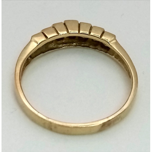 335 - A 14K Yellow Gold and Diamond Half-Eternity Ring. Seven square-cut diamonds. Size Q. 2.84g total wei... 