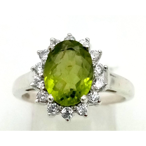 464 - 1.97 Ct Peridot 925 Silver Ring With White Topaz Stone surround. Size O.