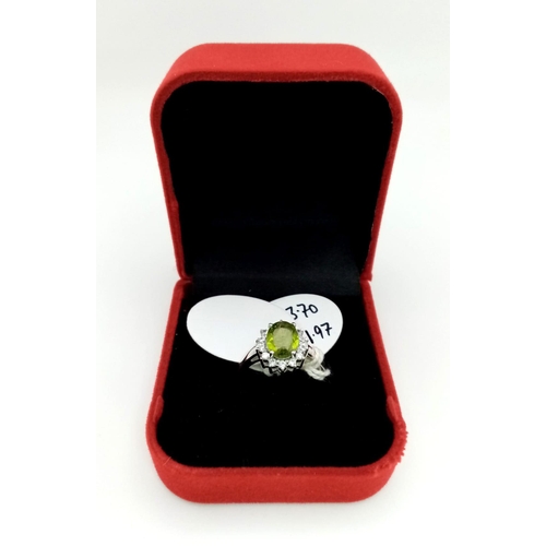 464 - 1.97 Ct Peridot 925 Silver Ring With White Topaz Stone surround. Size O.