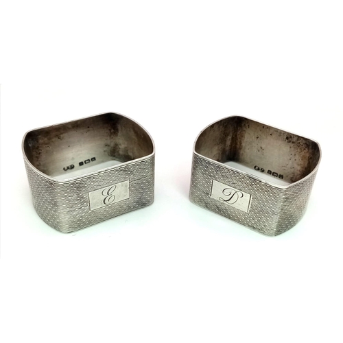 593 - A Pair of Vintage Sterling Silver Napkin Holders. Guilloche decoration with cartouche. 50.37g total ... 