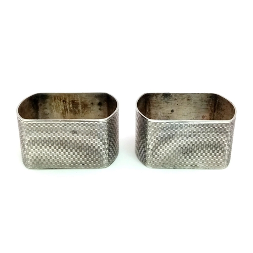 593 - A Pair of Vintage Sterling Silver Napkin Holders. Guilloche decoration with cartouche. 50.37g total ... 