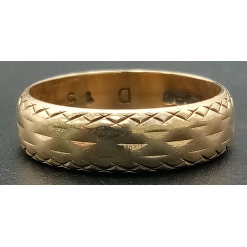 77 - A Vintage 9K Yellow Gold Band ring with Geometric Engraving. Size N. 3.44g total weight.