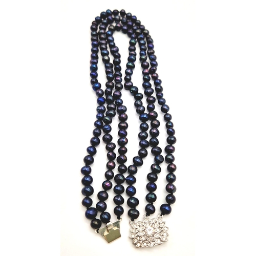 103 - A vintage, necklace with 3 rows of natural, individually hand knotted, Tahitian, black pearls and a ... 