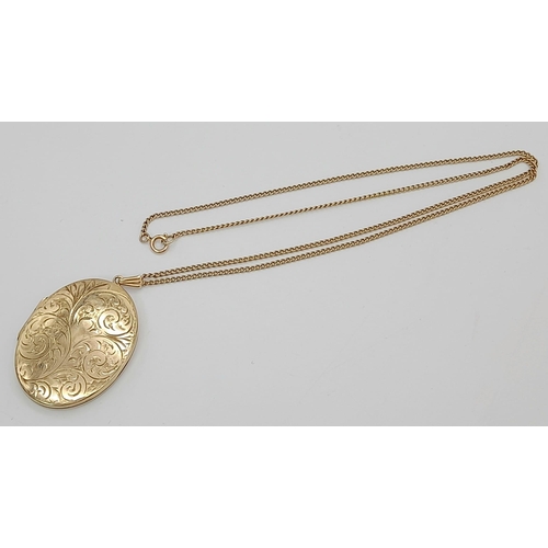 106 - A Vintage Large 9K Yellow Gold Locket Pendant on a 9K Yellow Gold Necklace. Scrolled engraved decora... 