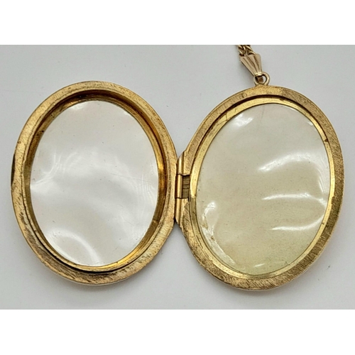 106 - A Vintage Large 9K Yellow Gold Locket Pendant on a 9K Yellow Gold Necklace. Scrolled engraved decora... 