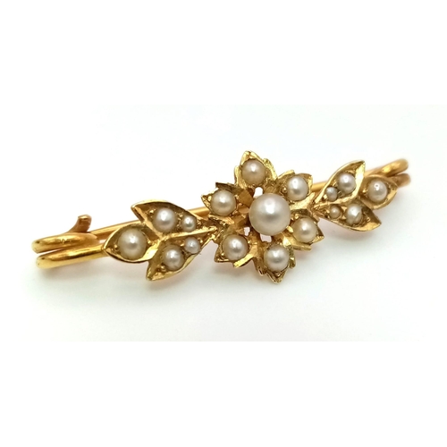 123 - A Victorian High Karat and Seed Pearl bar Brooch. Floral decoration. Comes with original Gibson and ... 