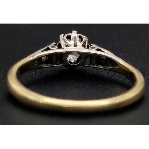 307 - A 9K Yellow Gold Diamond Ring. Central oval diamond with a further compliment of three diamonds on e... 