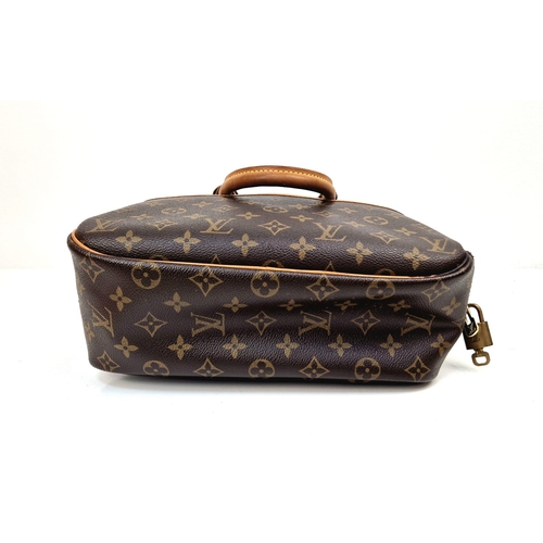 450 - A Louis Vuitton Deauville Bag. Monogram canvas with brown leather. Padlock and key. Four open interi... 