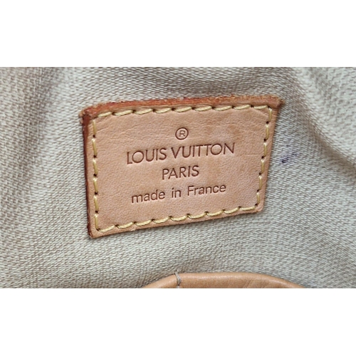 450 - A Louis Vuitton Deauville Bag. Monogram canvas with brown leather. Padlock and key. Four open interi... 